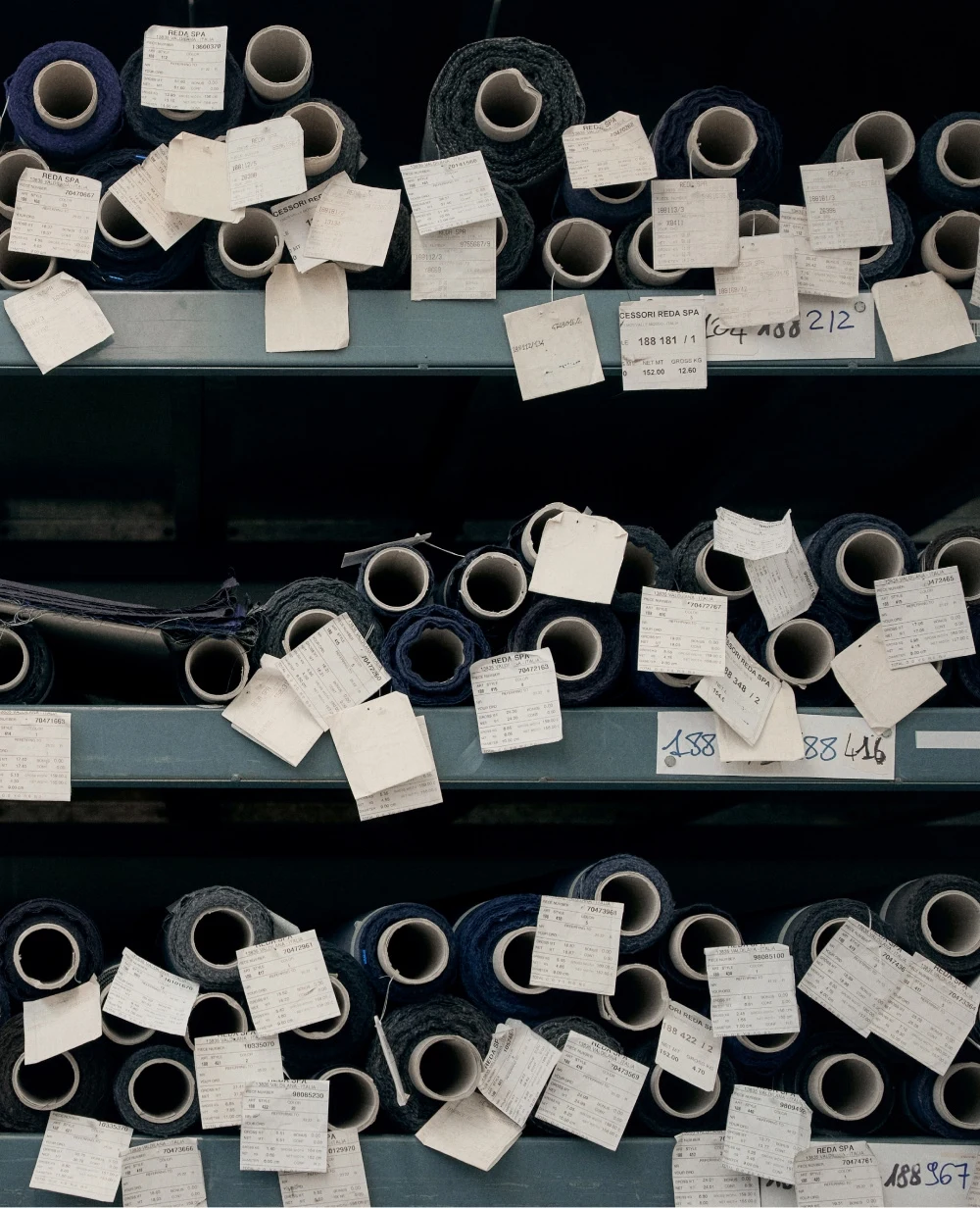 shelves containing spools of fabric