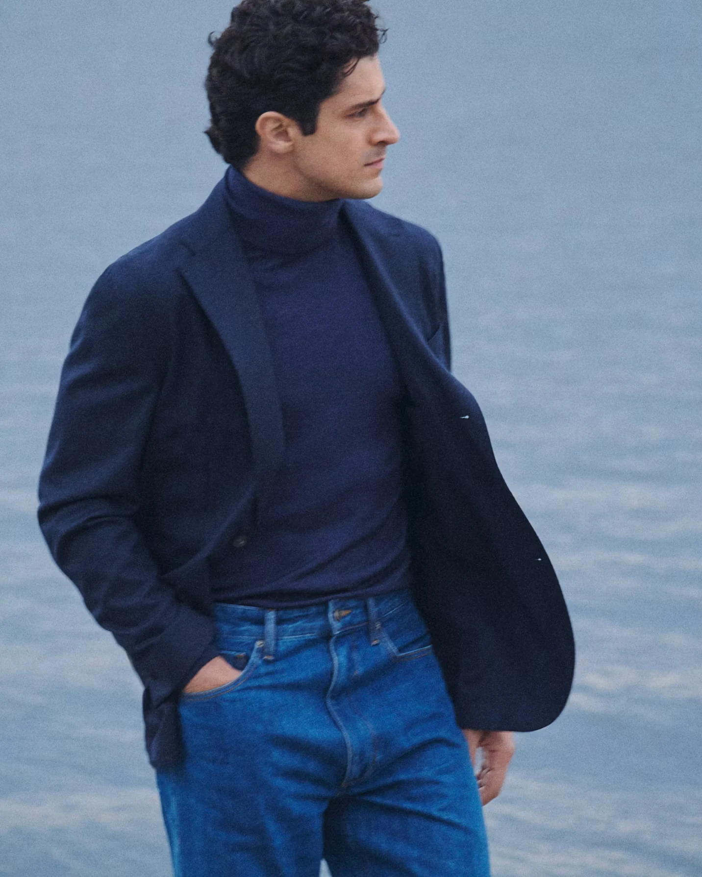 modell in flannel soft jacket and a blue turtle neck sweater