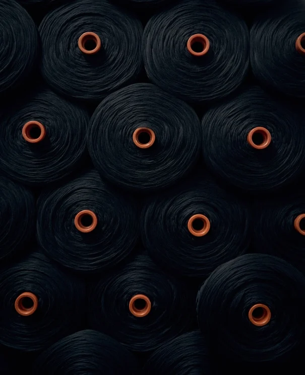 mutliple spools of merino wool fabric