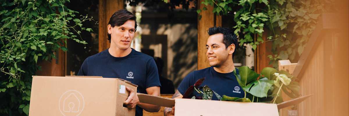 Two-people-carrying-moving-boxes