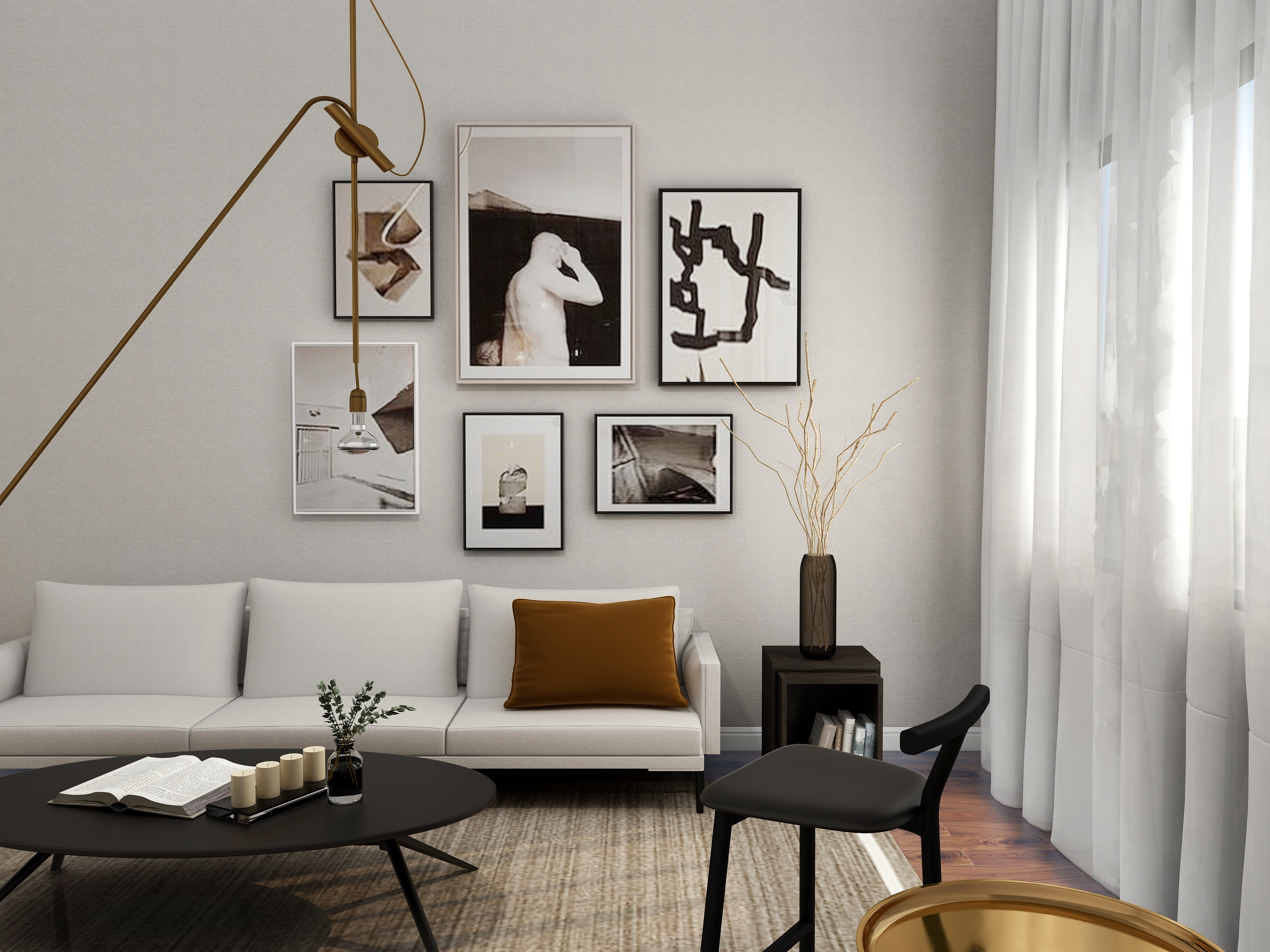 Vardagsrum-med-vit-soffa-och-tavlor