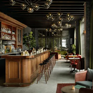 Interior bar and modern seating at Kamper's Rooftop Lounge located in Book Tower. 