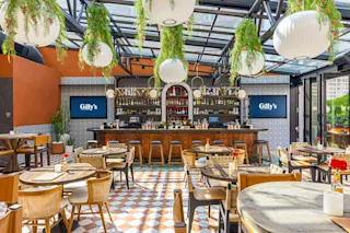 An interior photo of the Gilly’s rooftop bar and seating.