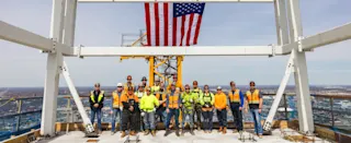 Construction crew at Hudson's Detroit topping off event. 