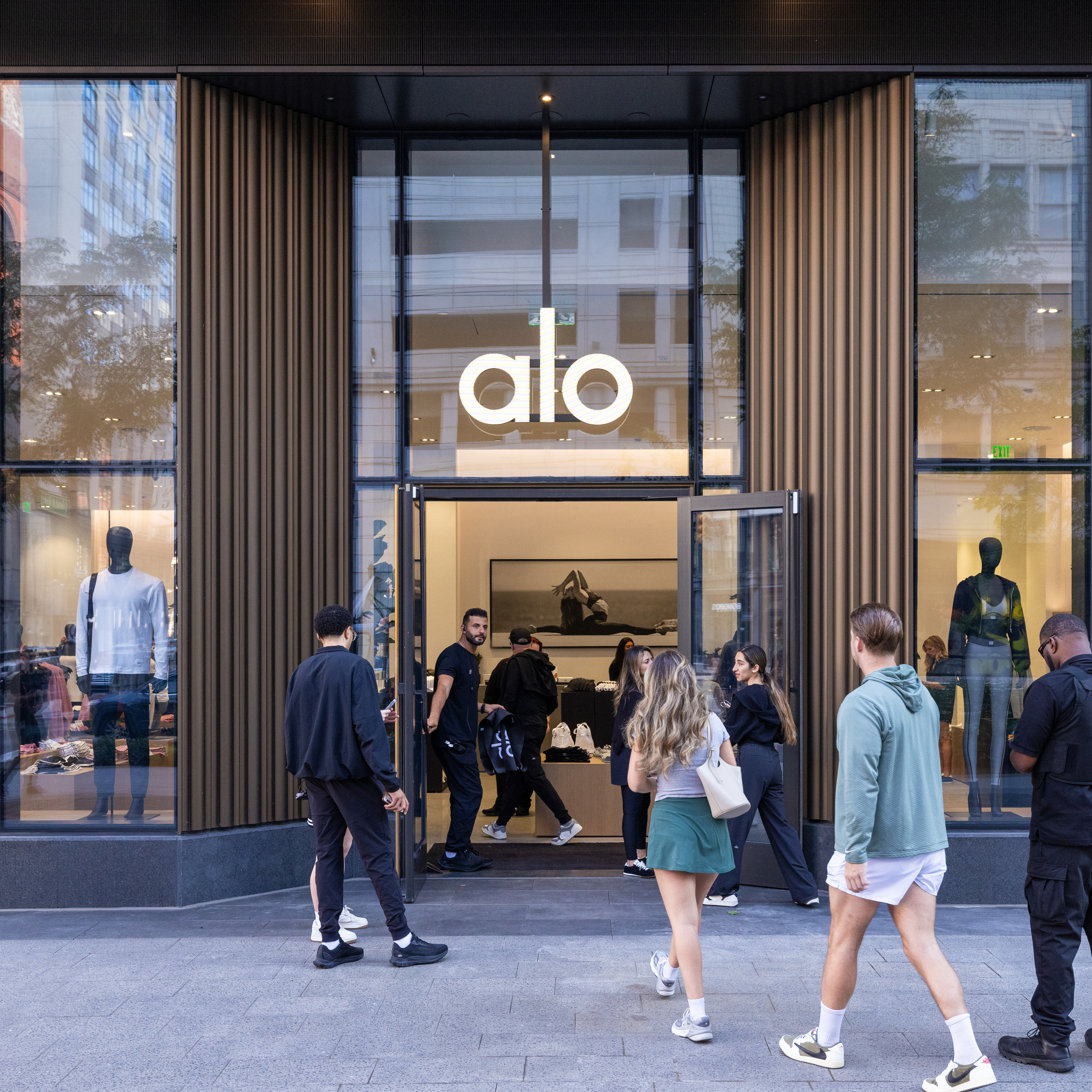 An exterior photograph of the Alo grand opening at Hudson’s Detroit, featuring activation (square ratio).