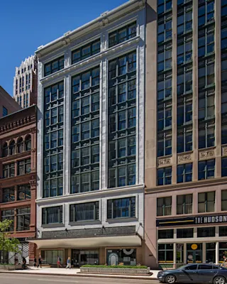 An exterior photo of 1225 Woodward showing the ground floor retail opportunities.