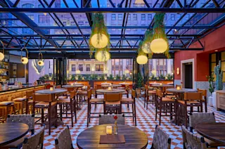 An interior photo of the Gilly’s rooftop seating at night.