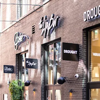 View of local business signage in Parker’s Alley. 