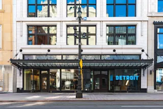 An exterior, street-level photo of the ground floor of 1515 Woodward.