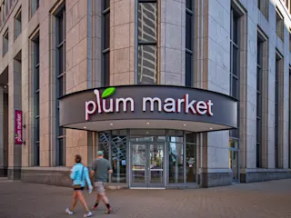 Exterior of Plum Market at Ally Detroit Center. 