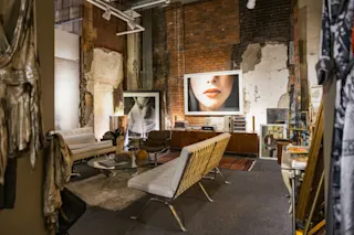 An interior photo of Lisa Spindler Studio featuring seating and artwork.