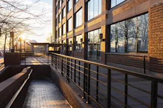 An exterior photo angled to show the ground floor retail opportunities at 300 River Place.