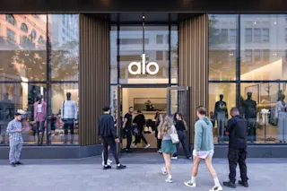 An exterior photograph of the Alo grand opening at Hudson’s Detroit, featuring activation.