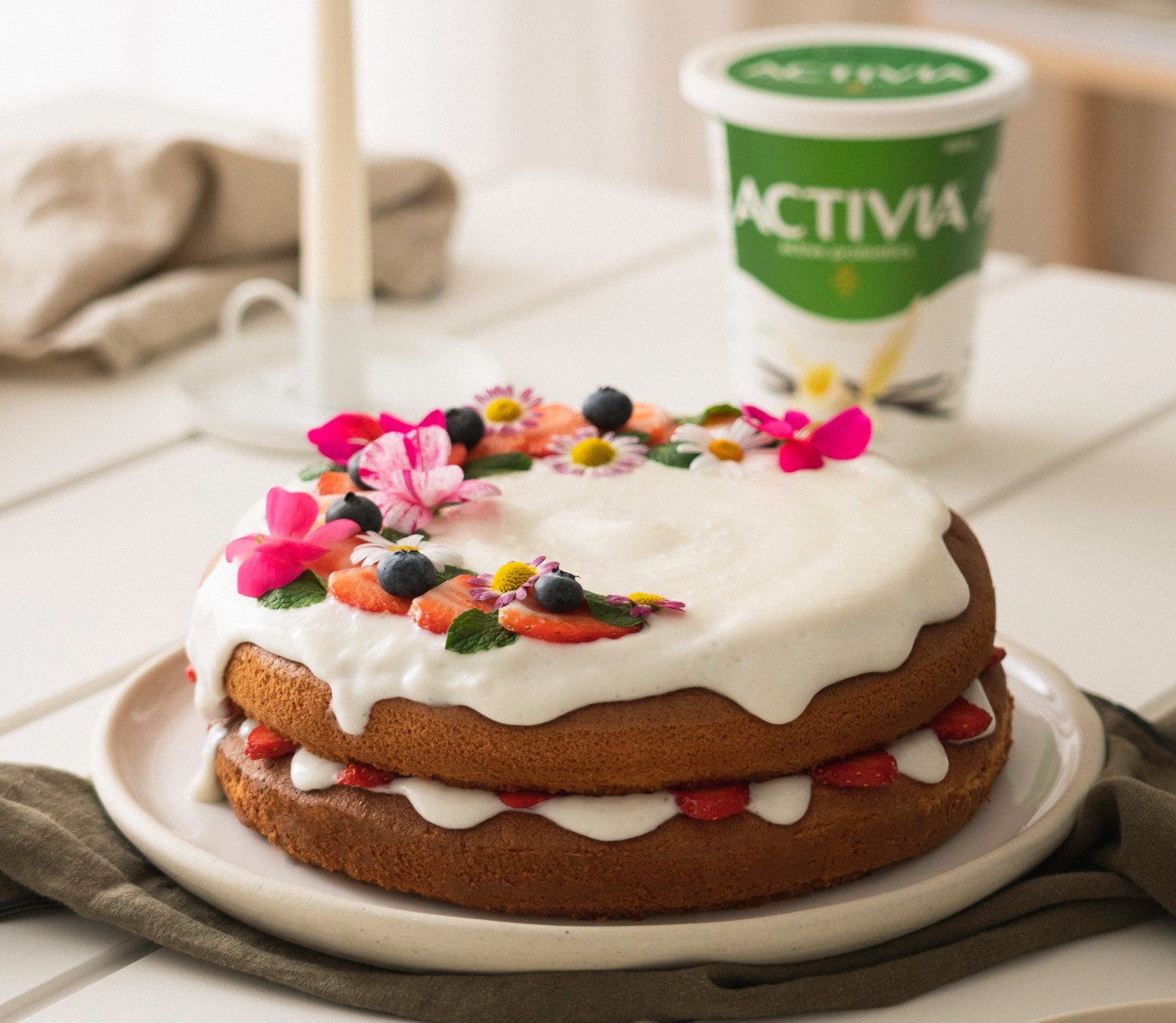 Lighter Cake Icing with Fresh Flower Garnish
