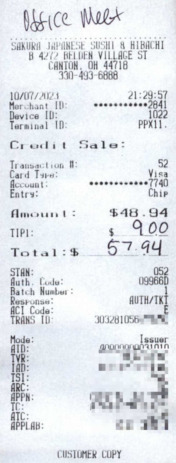 Real anonymized sushi restaurant receipt for $57.94 with a handwritten business-purpose note on the slip, the kind of contemporaneous substantiation the IRS accepts