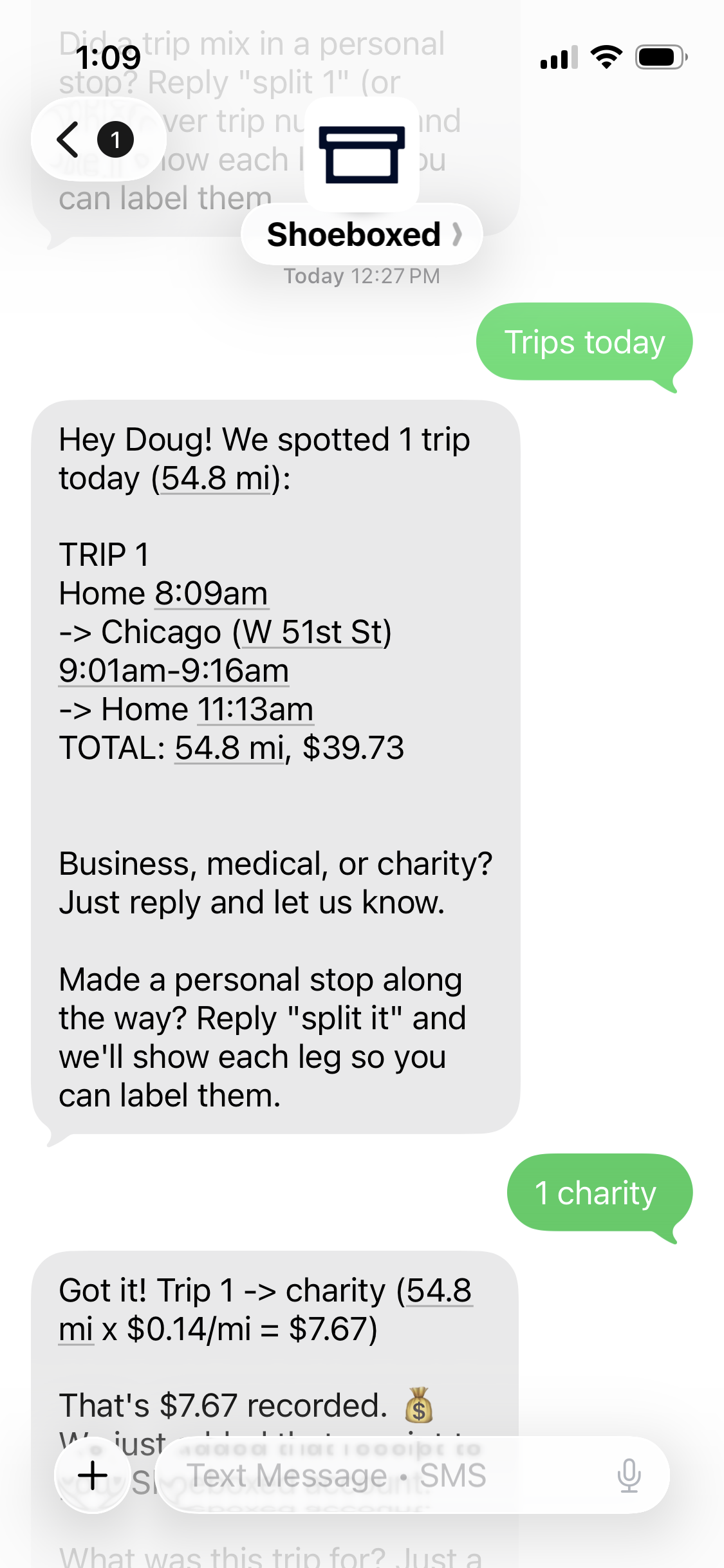 A Shoeboxed text message listing a tracked trip and asking business, medical, or charity, with the reply 1 charity and a confirmation that 7.67 was recorded