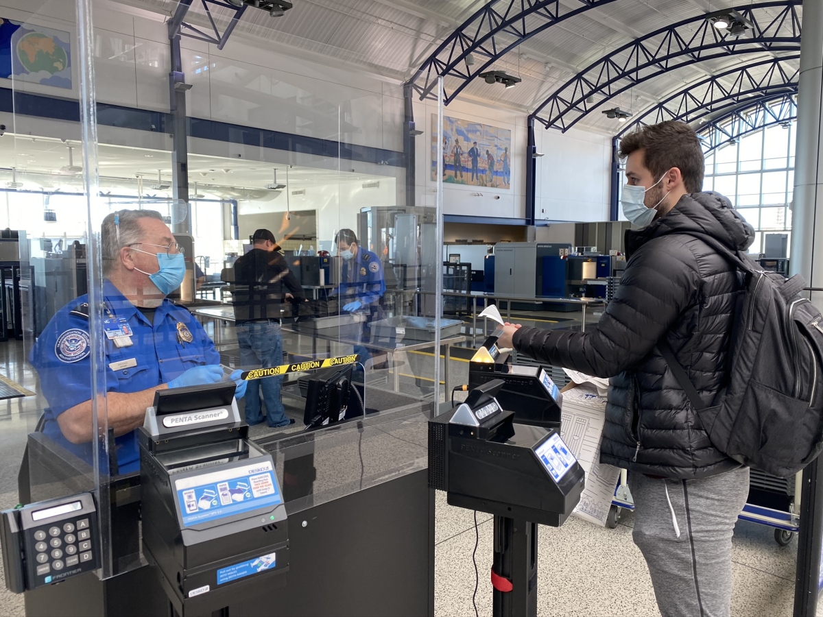 Passenger in TSA Line Interacting with TSA Agent