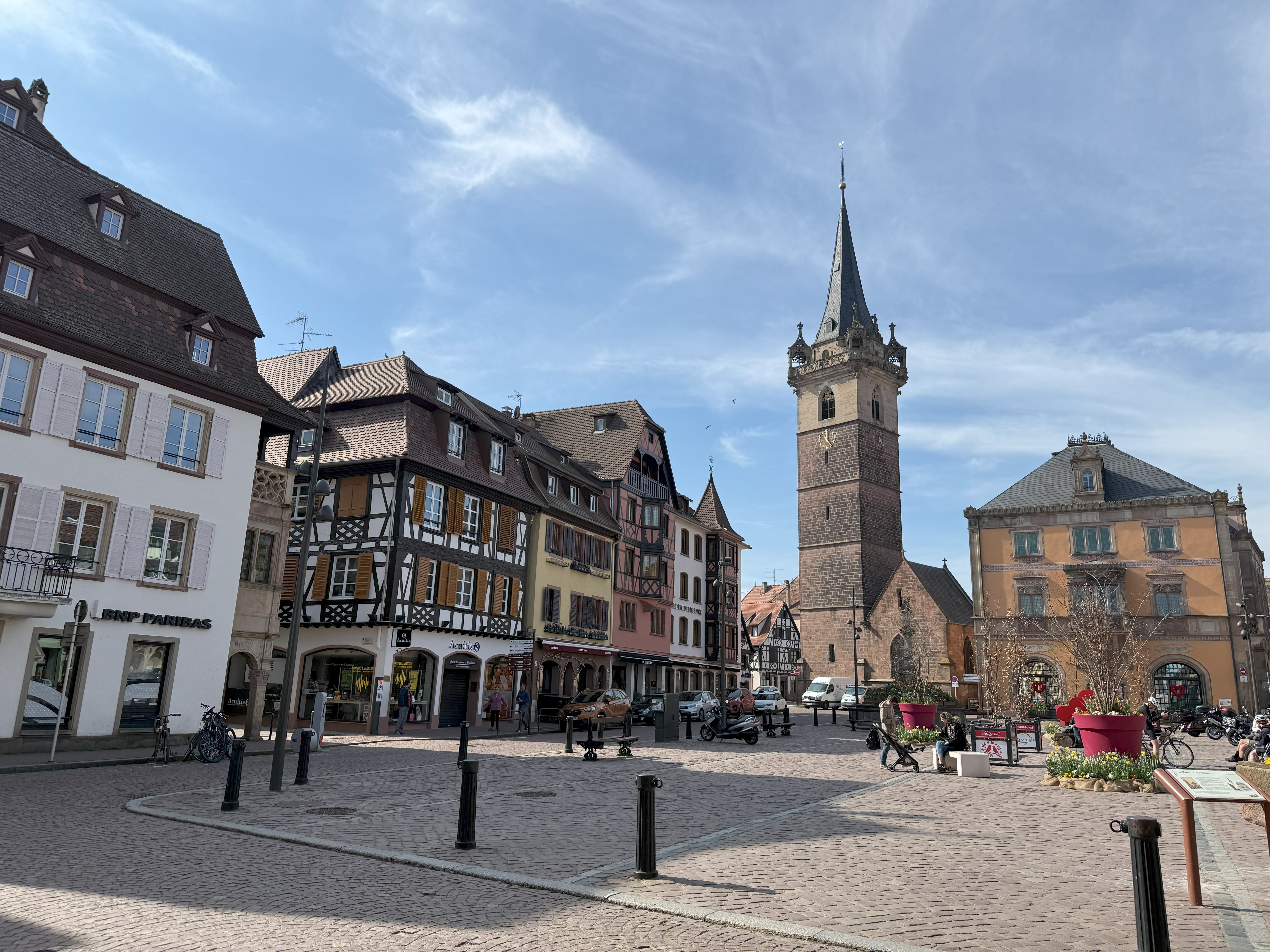 A photo of a cobblestoned square with old European style architecture all around.