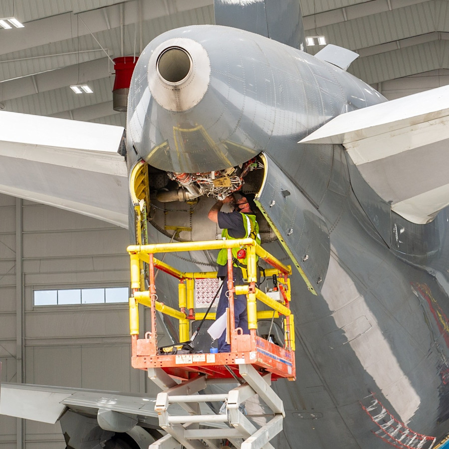 An aviation mechanic working on a plane.