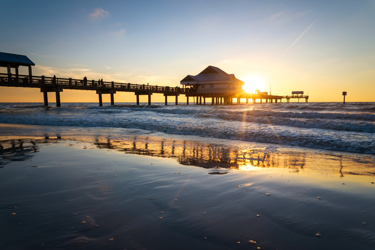 A photo of a pier at Clearwater Beach at sunset.