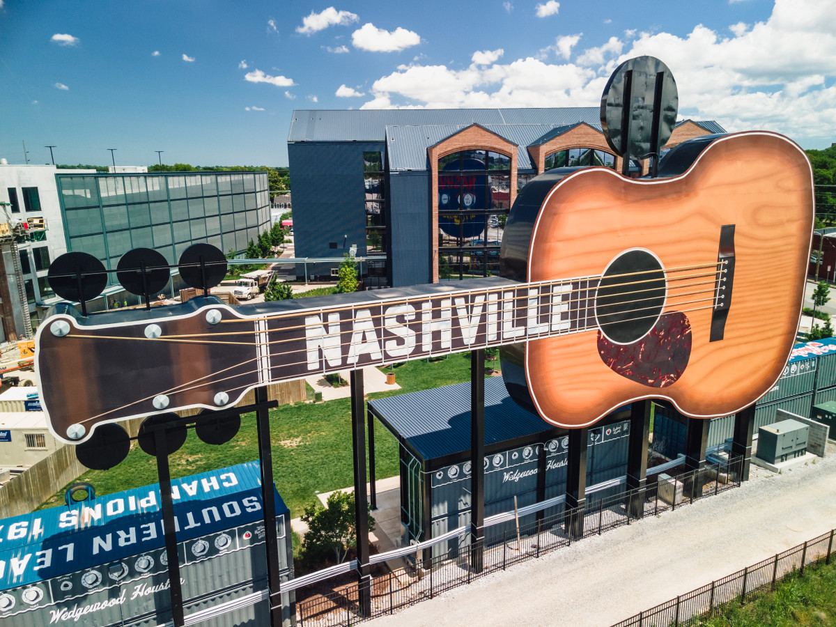 A photo of a giant guitar with the Nashville painted on it.