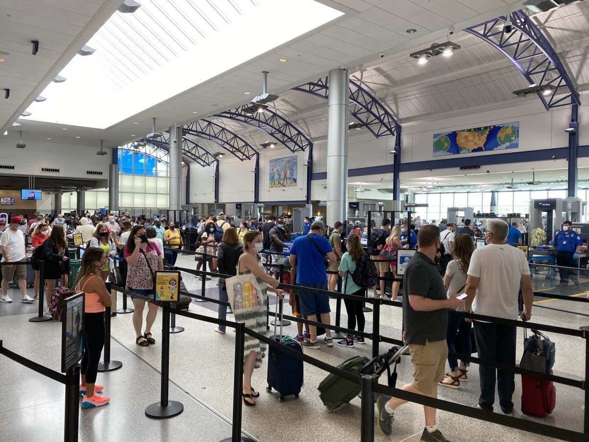 Passengers waiting in TSA line.