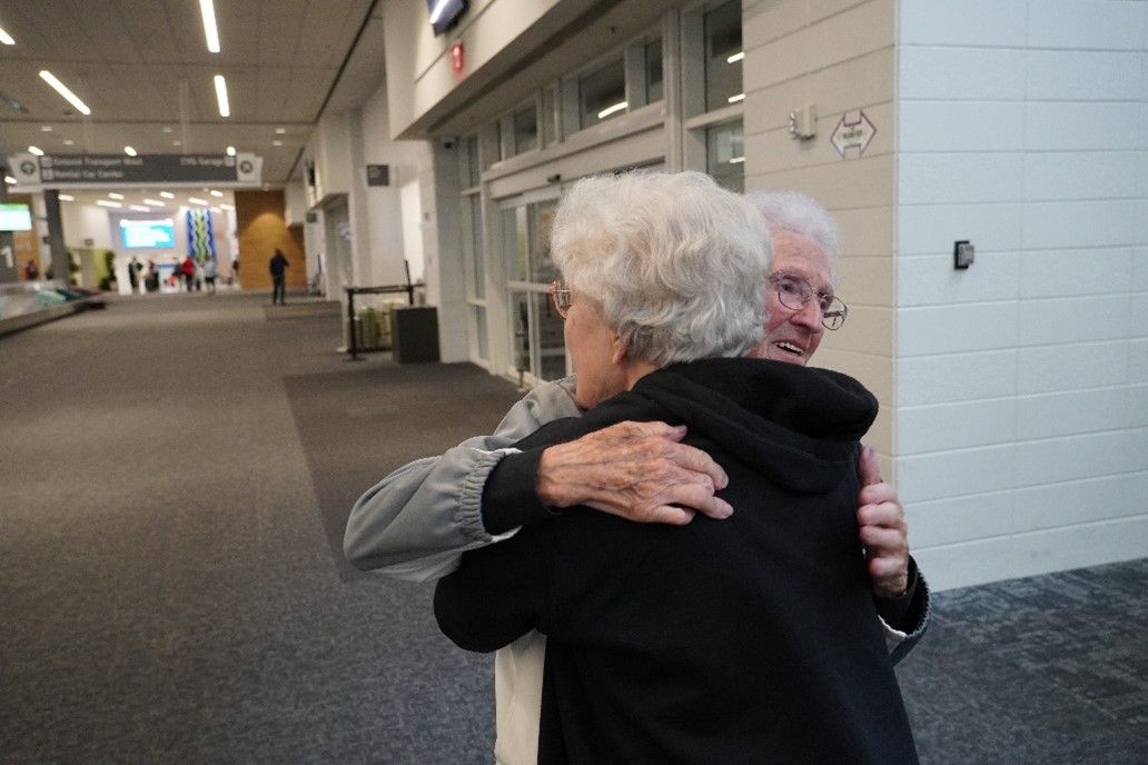 A League of their Own - Mary Moore and Lois Youngen hugging
