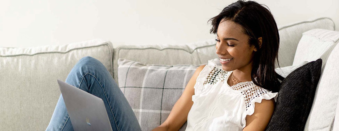 woman-on-couch-laptop-header-cropped