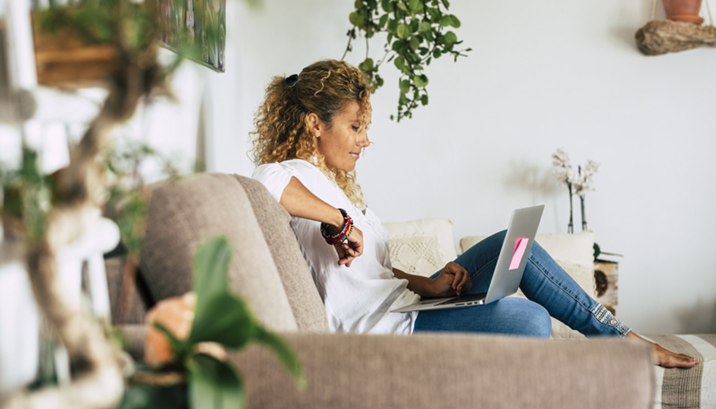 woman-on-couch-looking-at-laptop-header
