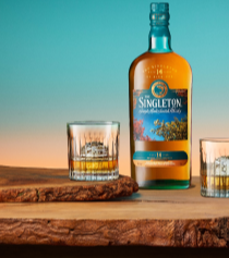 A bottle of The Singleton 14-Year-Old Single Malt Scotch Whisky is elegantly displayed on a rustic wooden surface
