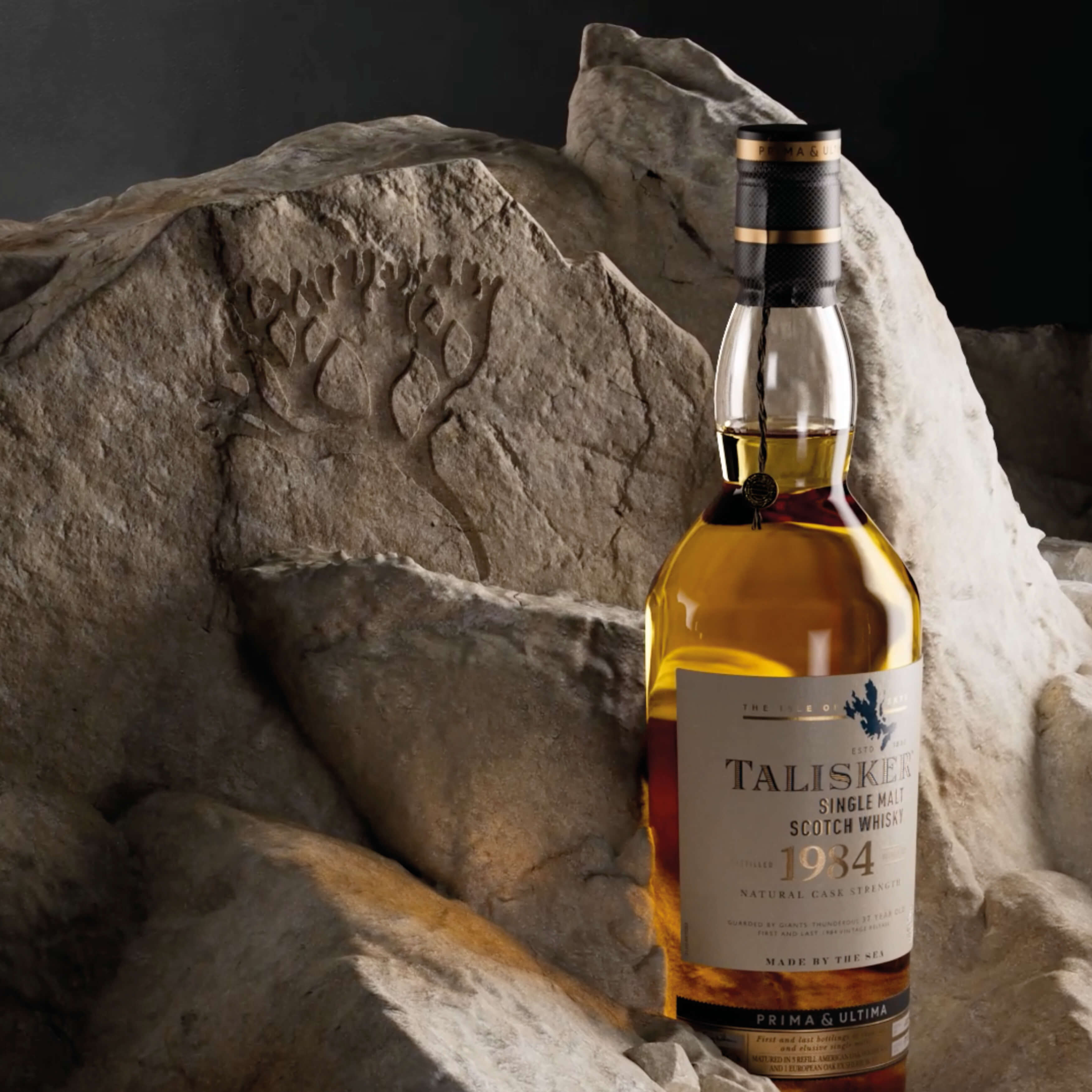 A luxurious close-up product shot of a Talisker 1934 Single Malt Scotch Whisky bottle, set against a backdrop of textured stones