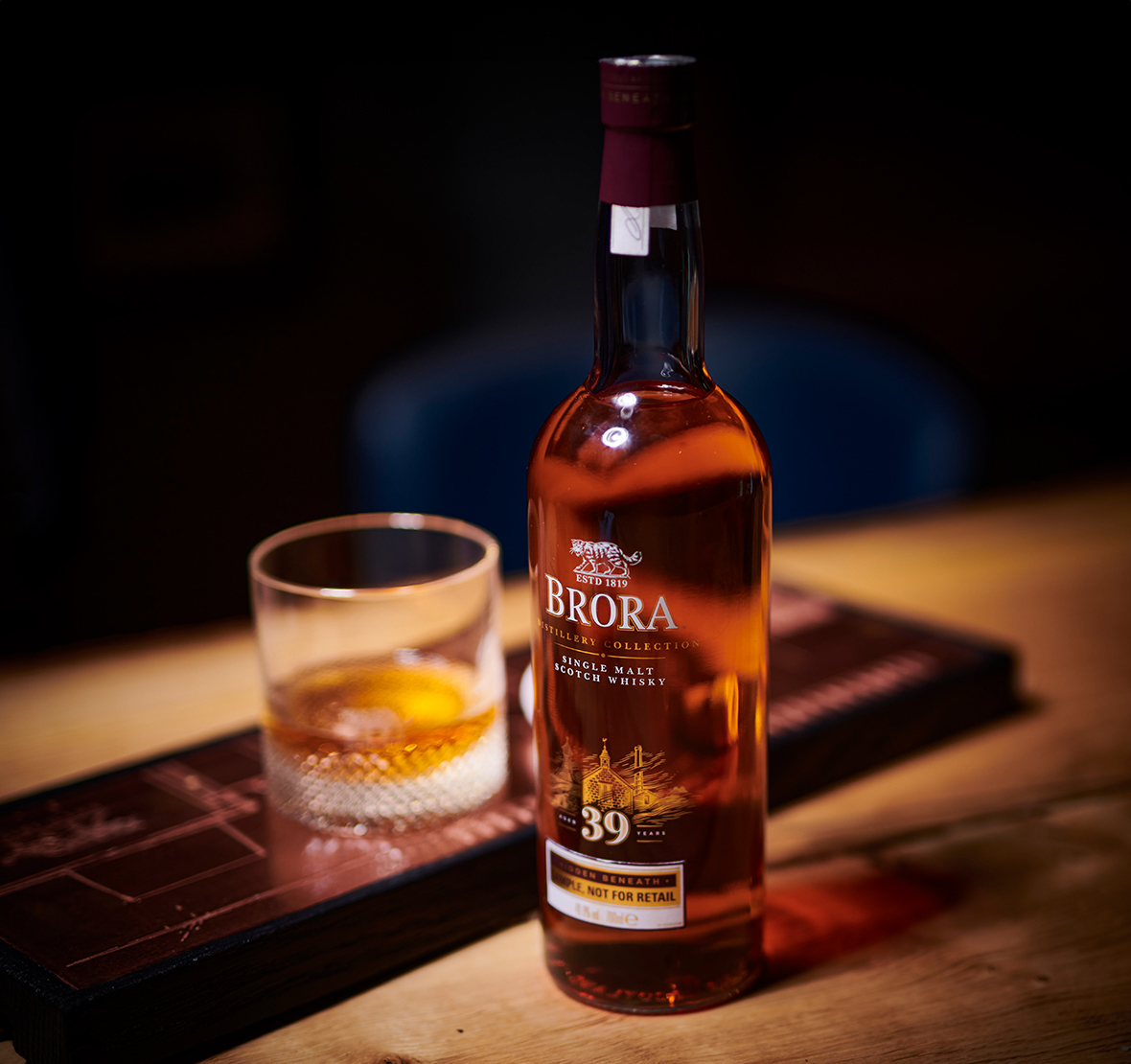 A bottle of Brora 39 Year Old and a glass on a table