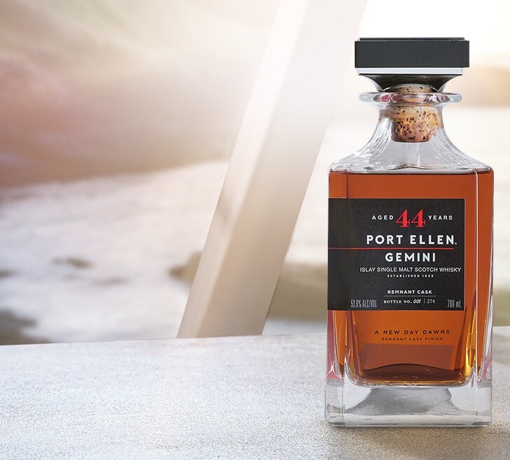 A close-up of a Port Ellen 44-Year-Old 'Gemini' Single Malt Scotch Whisky bottle. 