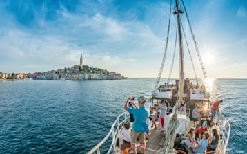 Tourists enjoy their vacation on the boat
