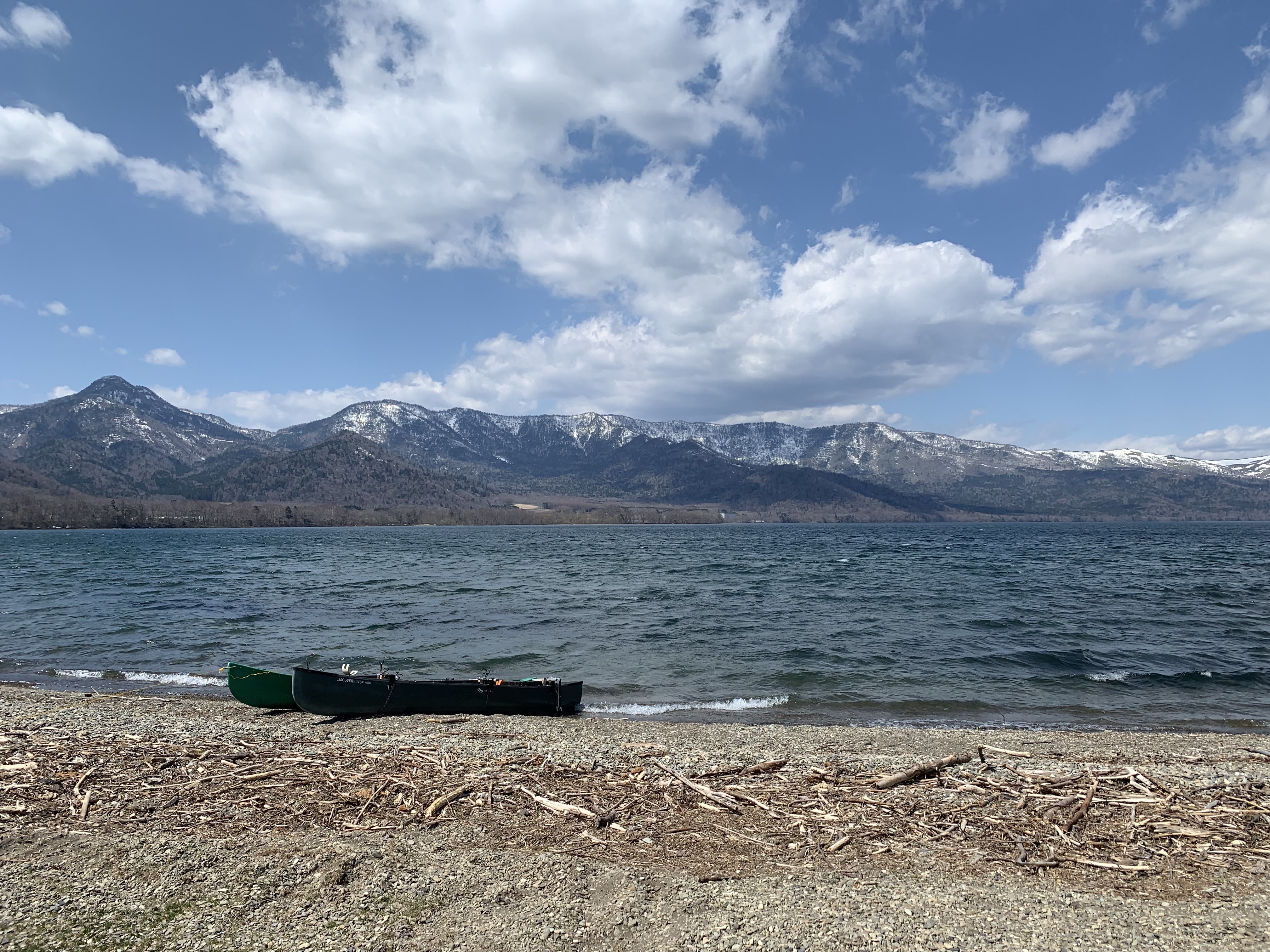 Two canoes on the shore at Sunayu in April