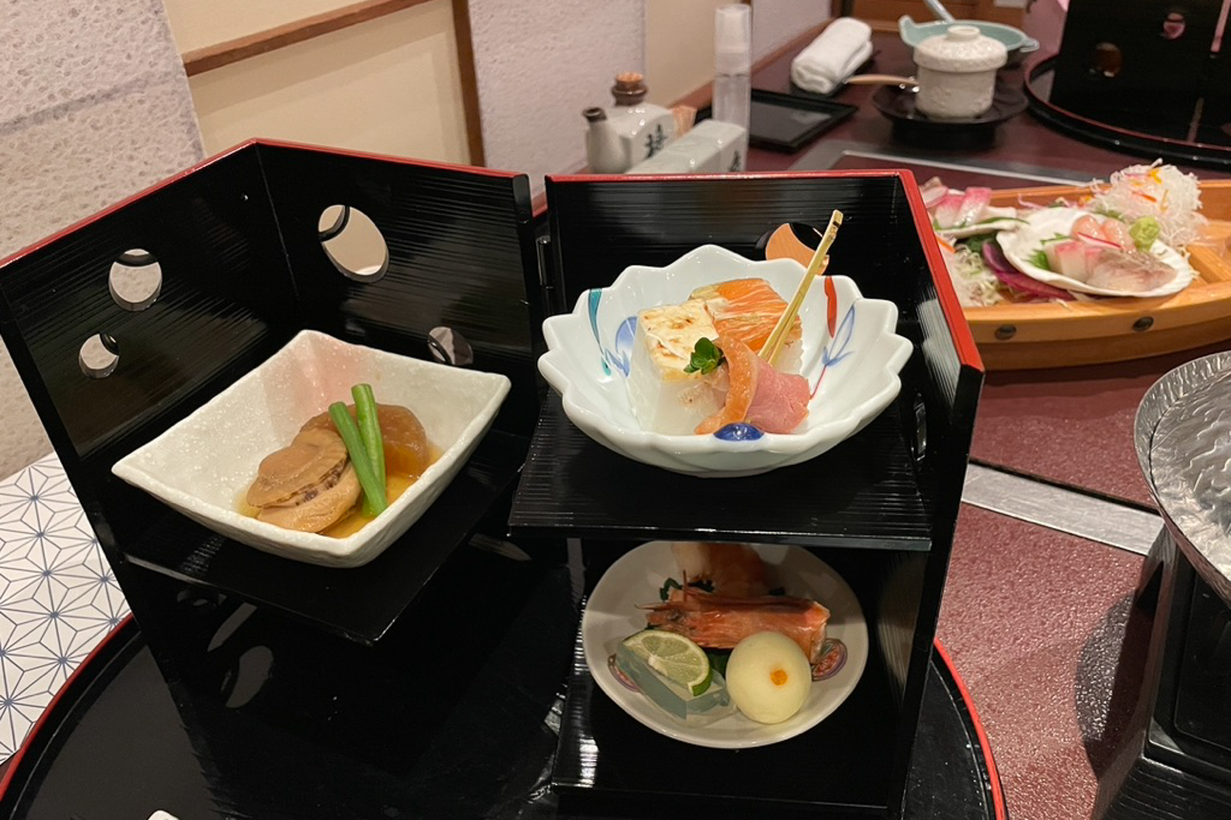 Japanese traditional dinner Kaiseki served in two-story lacquer shelves.