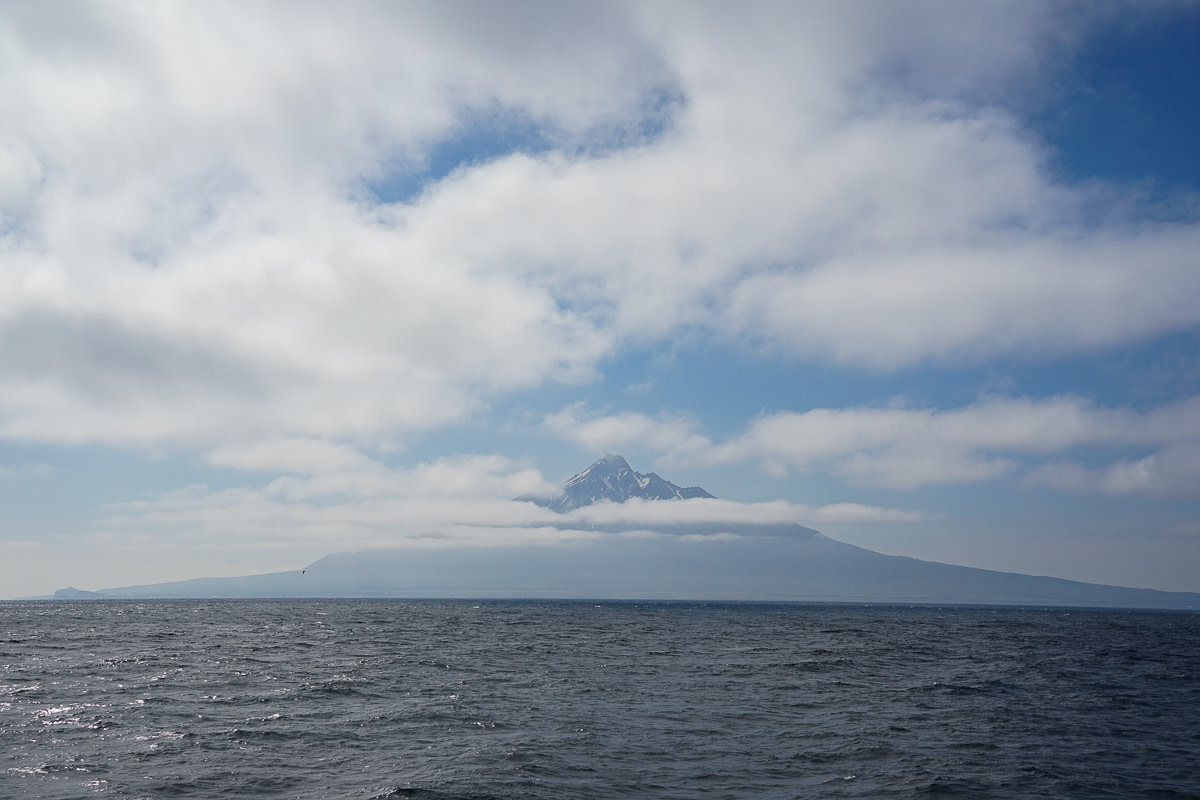 The triangular summit Mt Rishiri rises from the sea