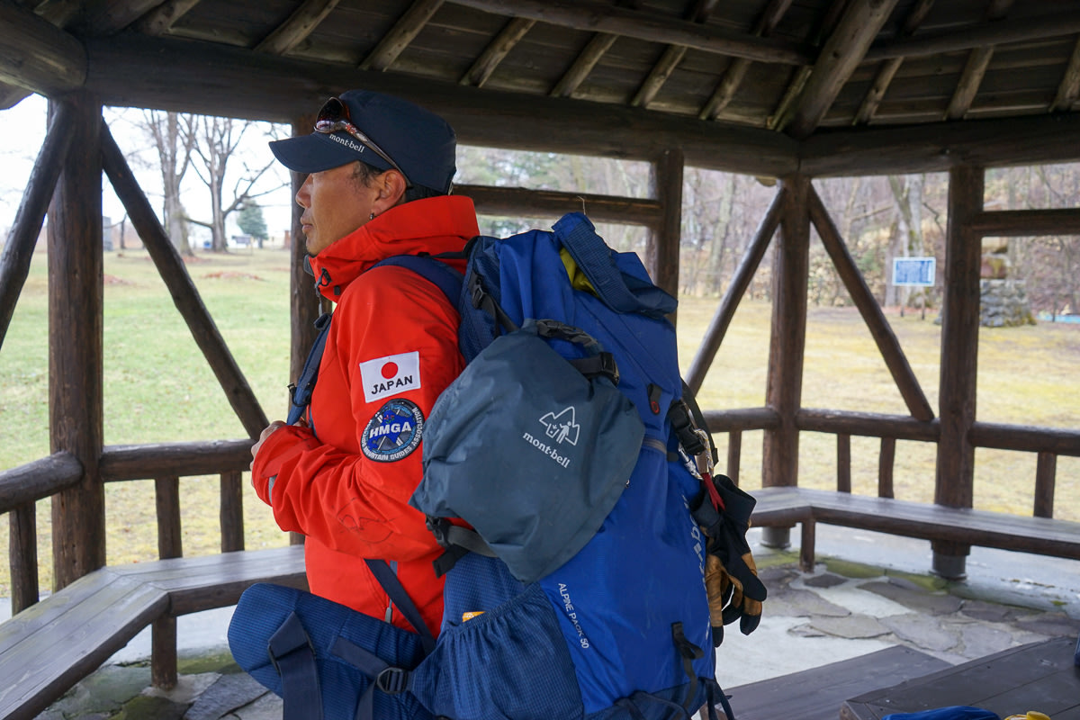 Adventure Hokkaido Guide Yasu showing how he places a mobile toilet bag