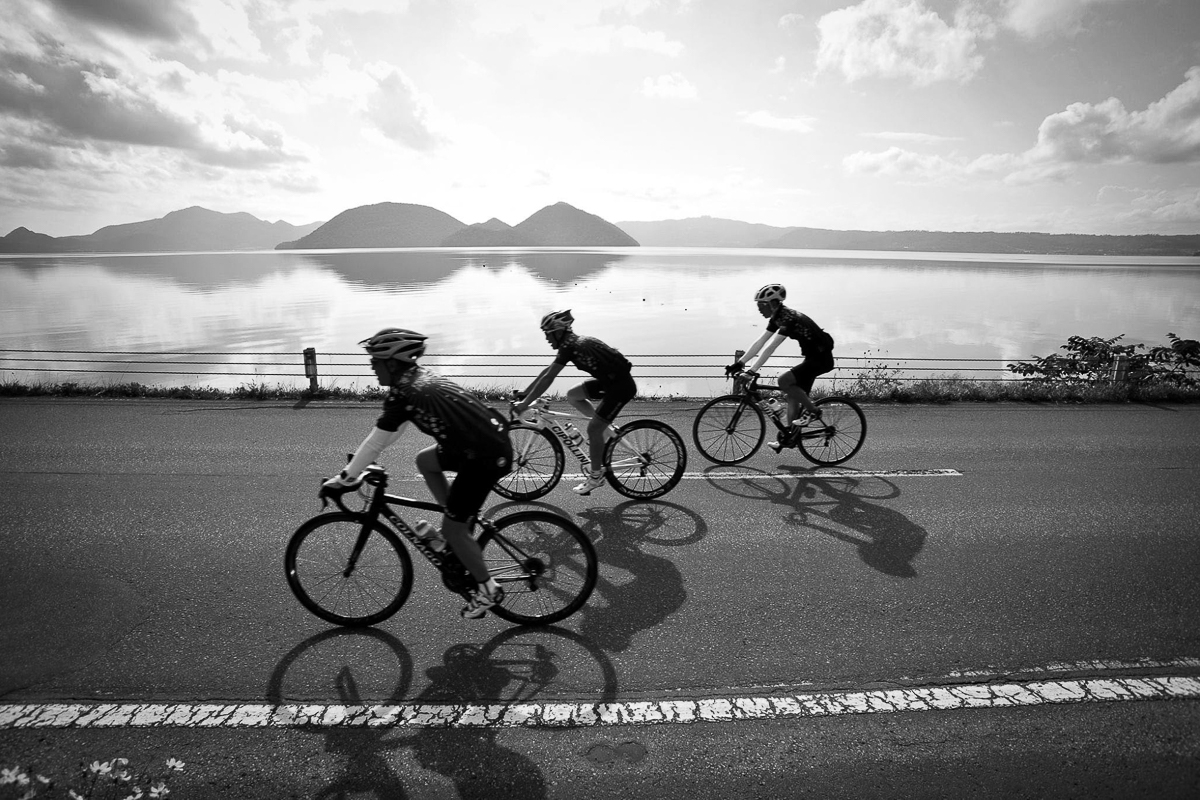 Cycling by tranquil Lake Toya