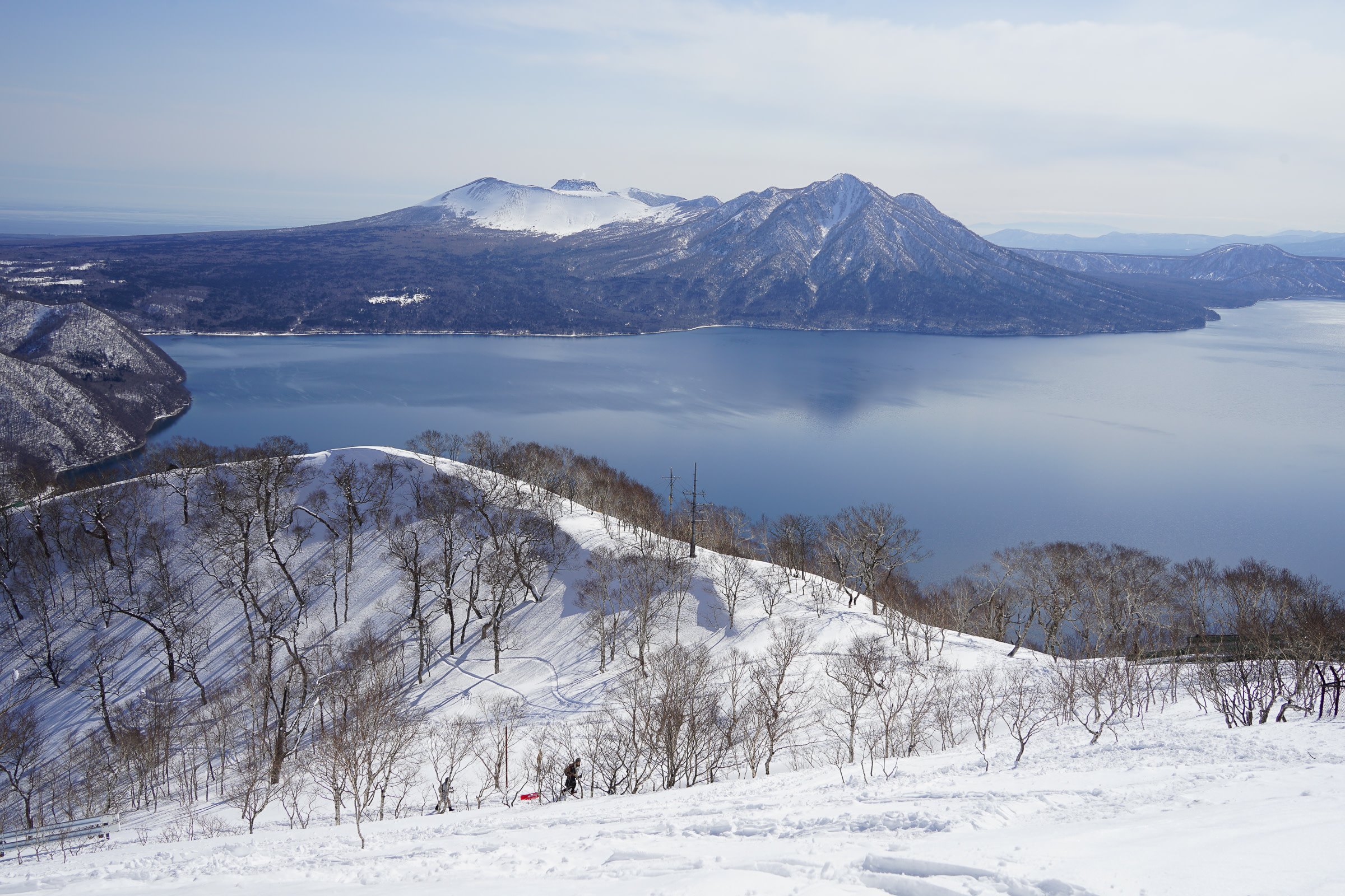 A view of Mt. Tarumae, Mt. Fuppushi & Lake Shikotsu taken from the summit of Mt. Monbetsu in winter.