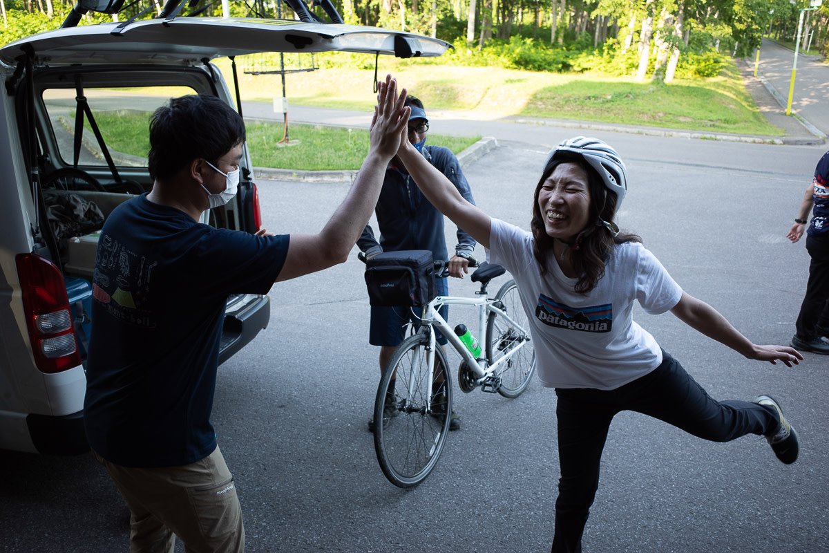 Cyclists celebrate reaching their goal for the day