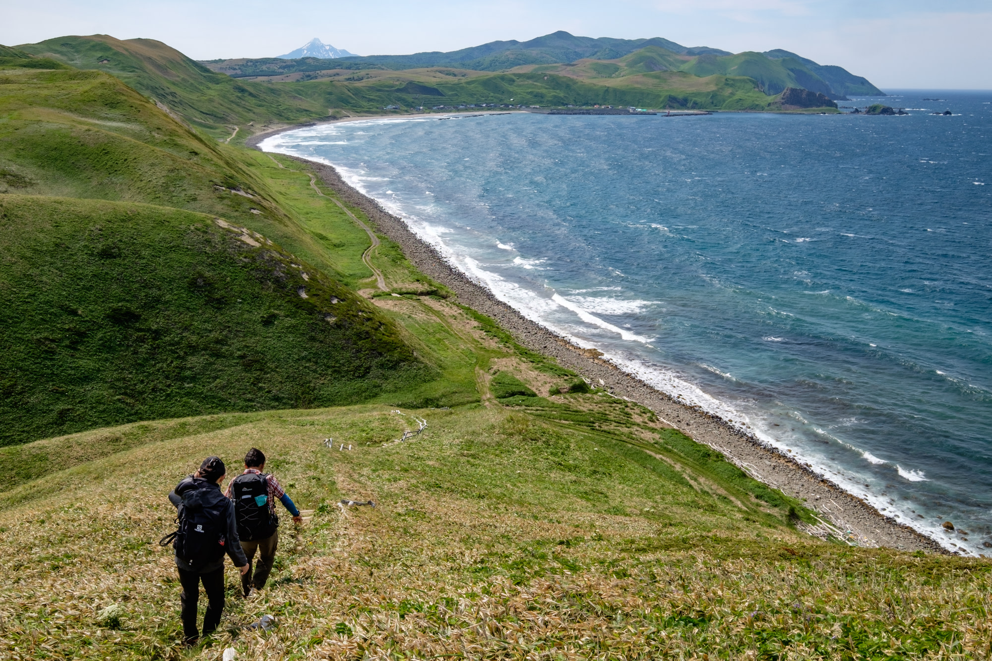 Hikers descending to a beach on Rebun island