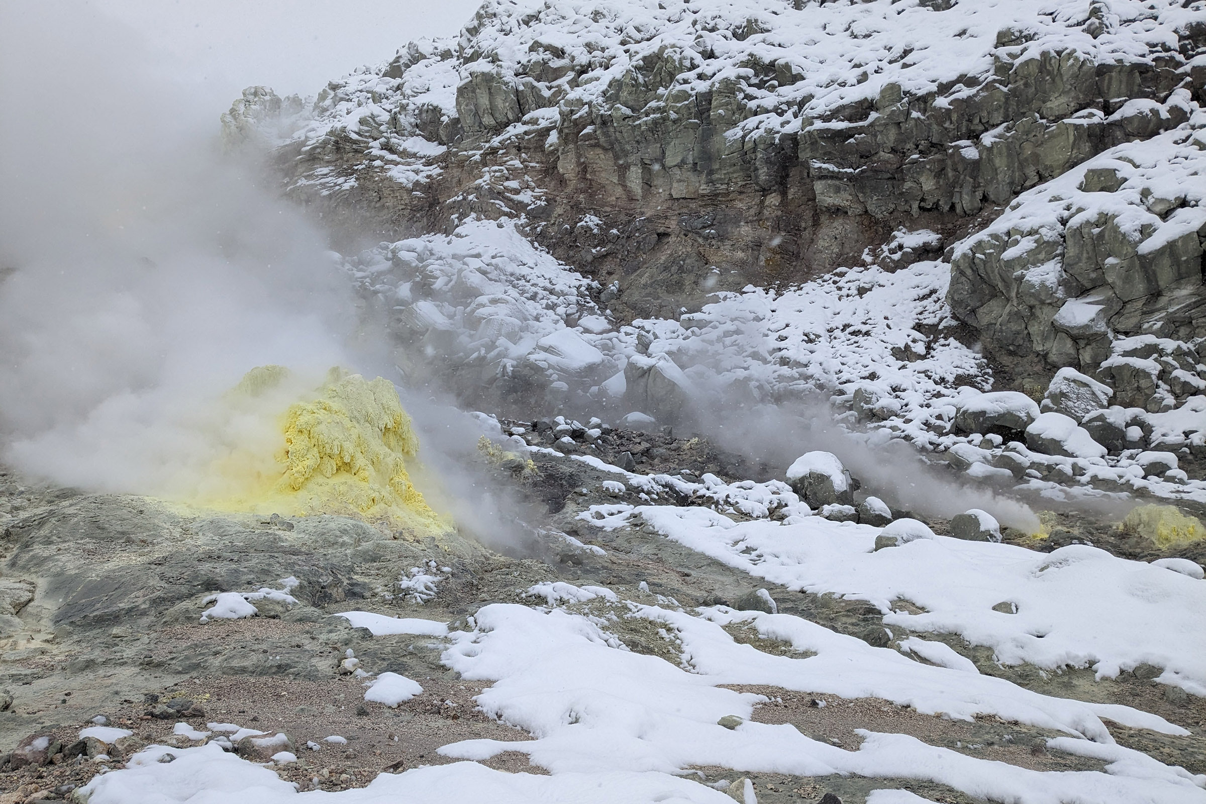 Steam rises from yellow sulphurous vents at Mt Io in the Akan–Mashu national park. The hot ground has melted the snow from around the vents.