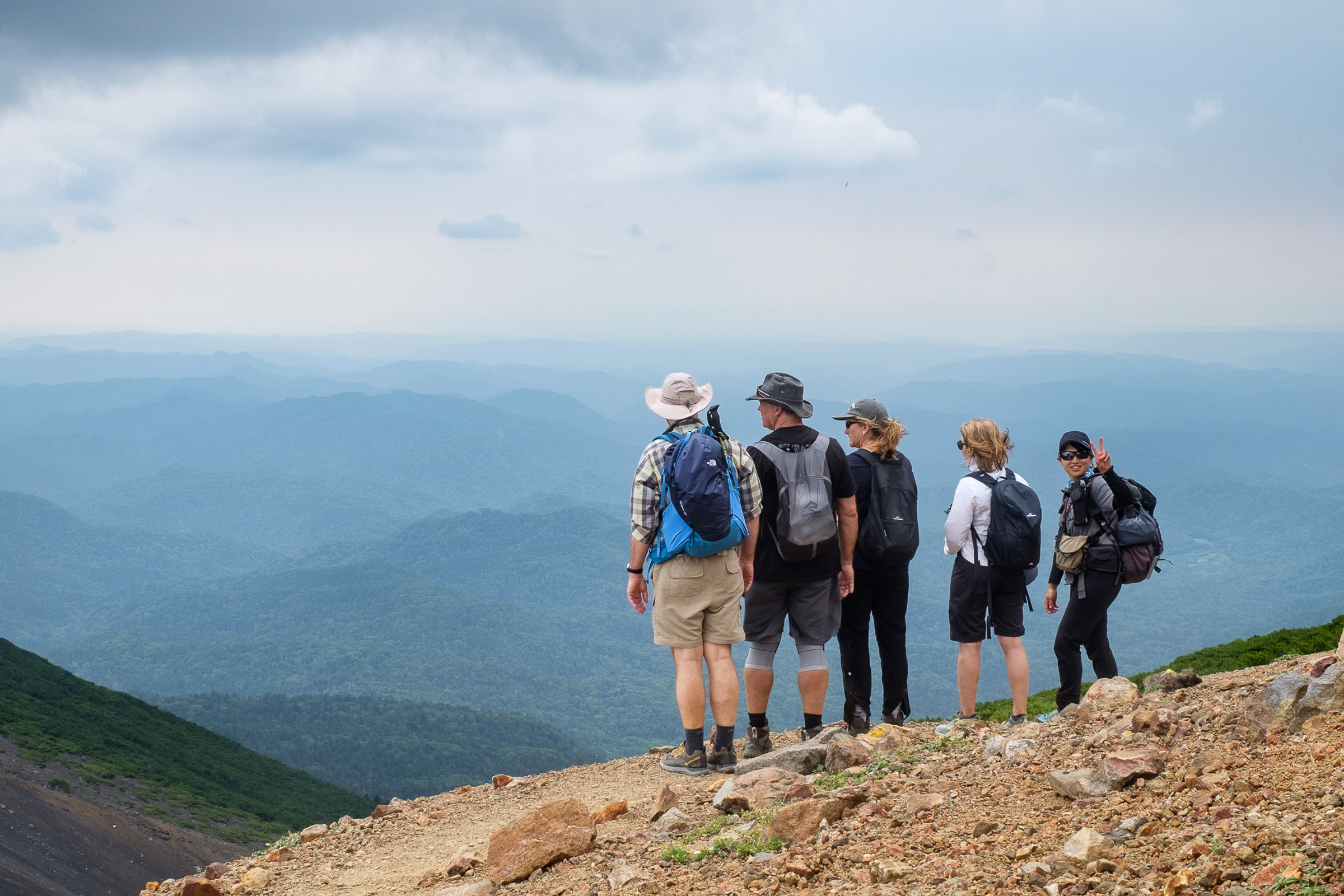 Adventure Hokkaido guide Yuka and guests at Mt. Meakan, Akan–Mashu National Park.