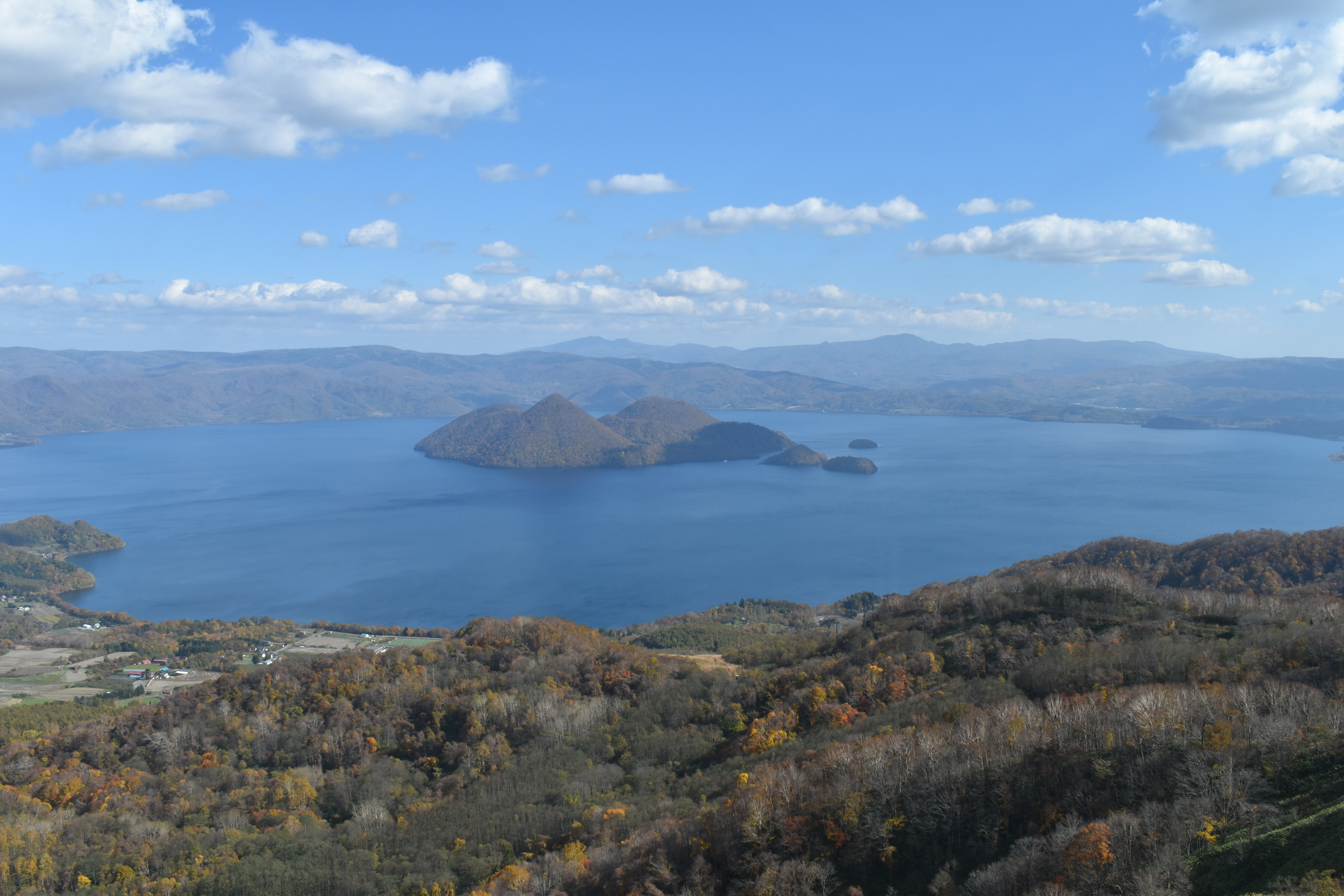 Lake Toya in autumn with most of the surrounding trees having already shed their leaves.