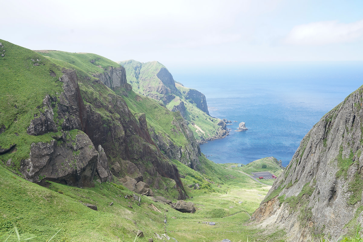Green topped cliffs overlook the ocean on Rebun Island