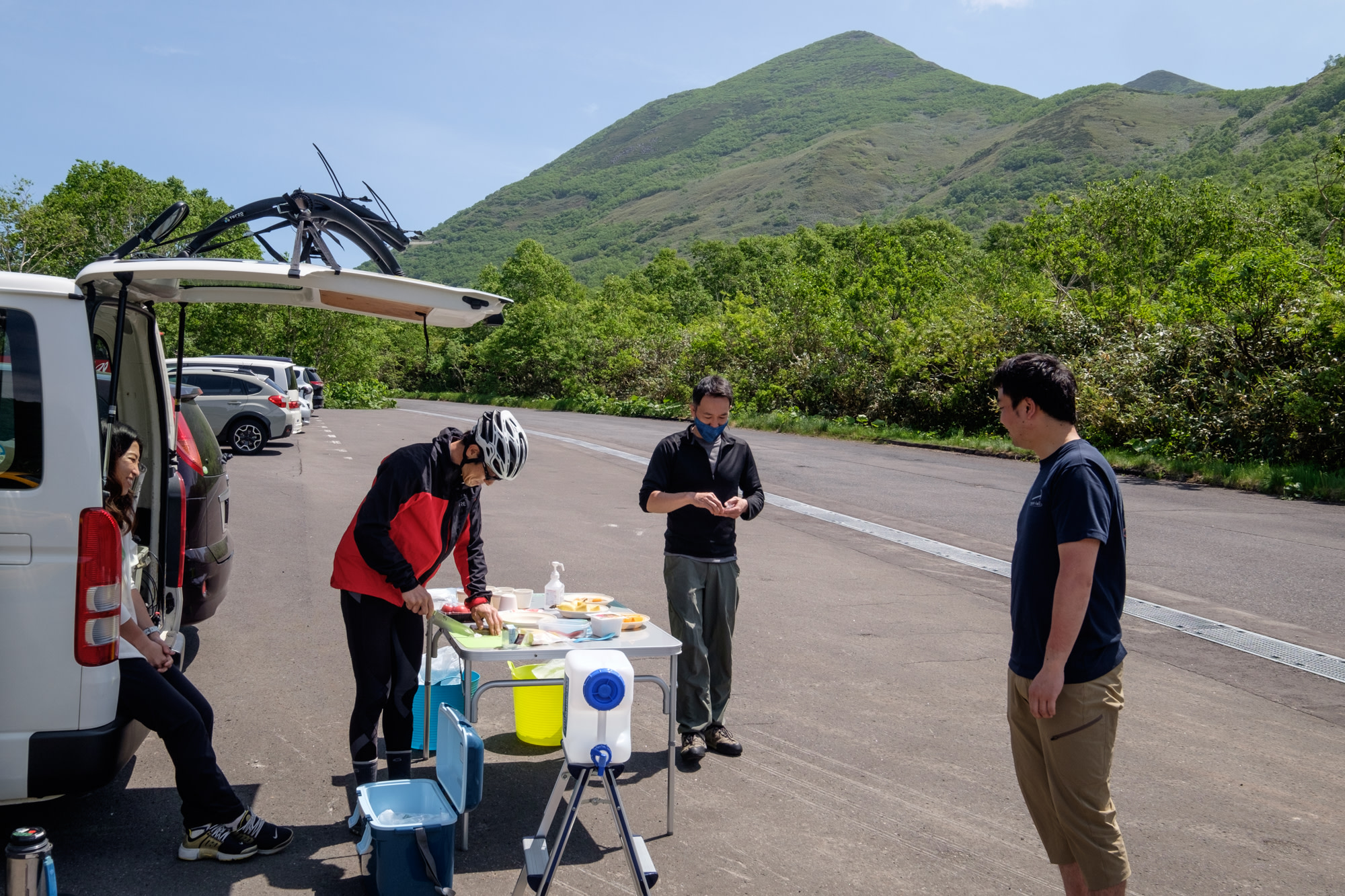 A guide prepares lunch on a cycling tour in Niseko