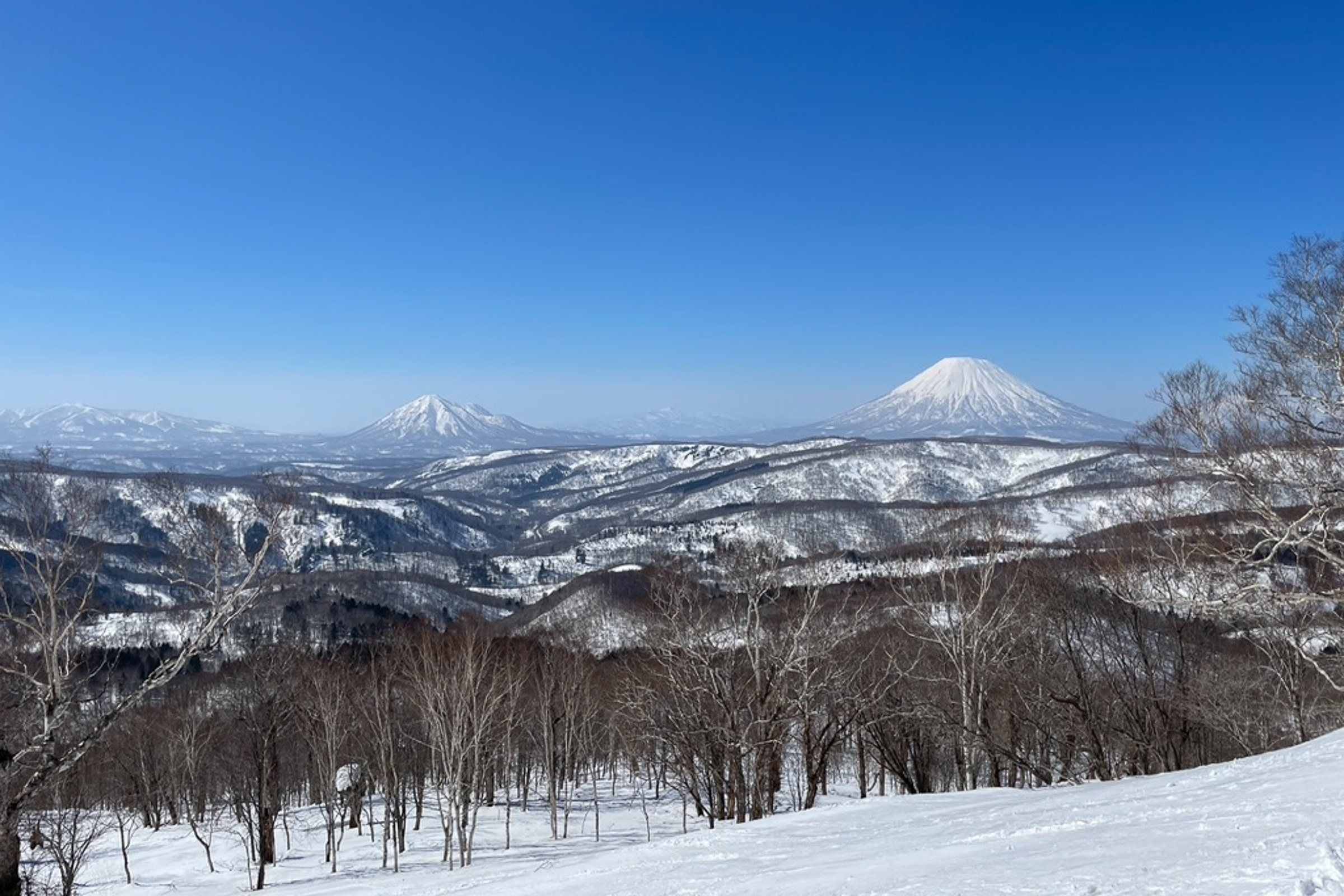Snowcapped Mt. Yotei & Mt. Shiribetsu captured from Mt. Kokimobetsu.