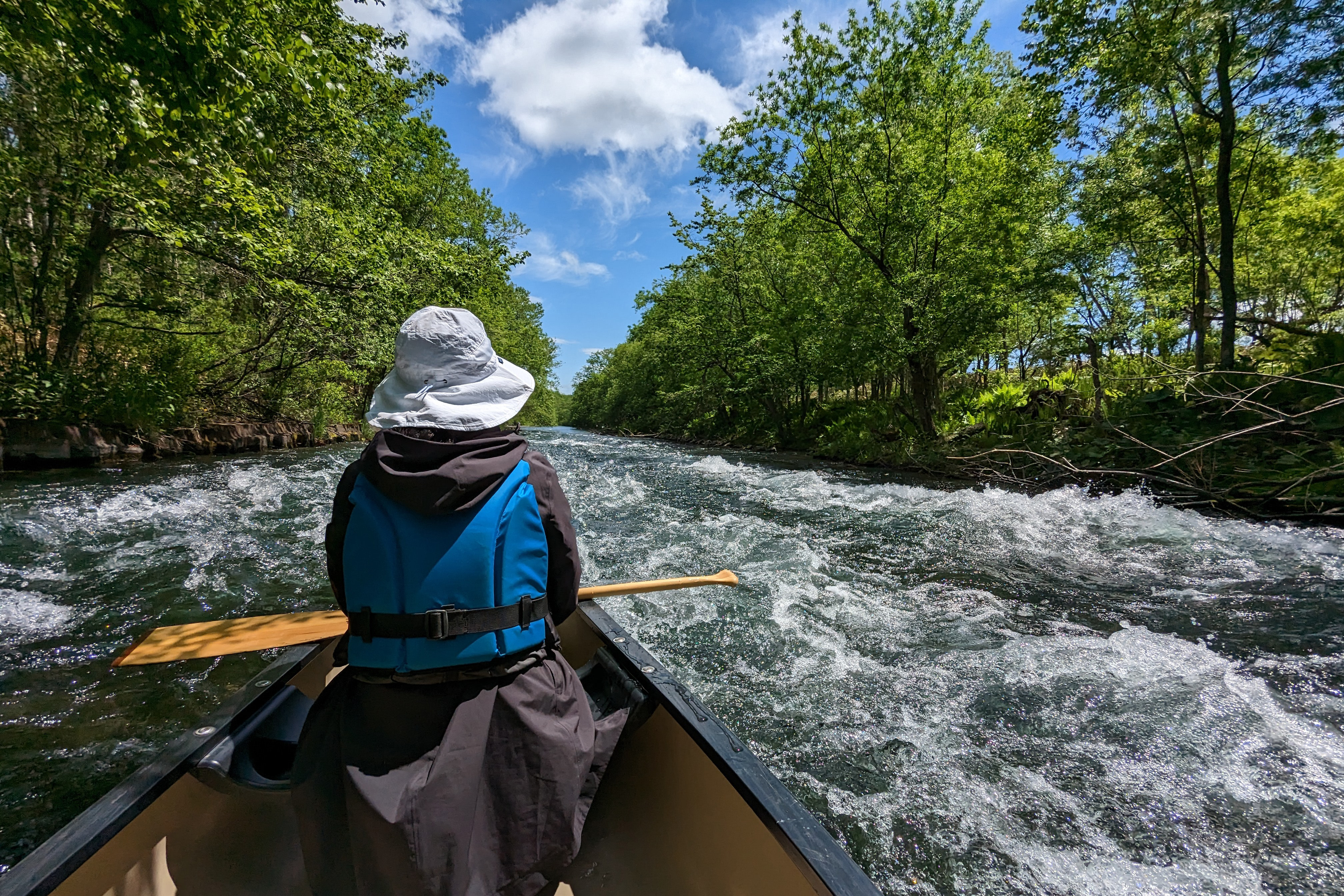 A canoeist takes in some small rapids on the Kushiro river