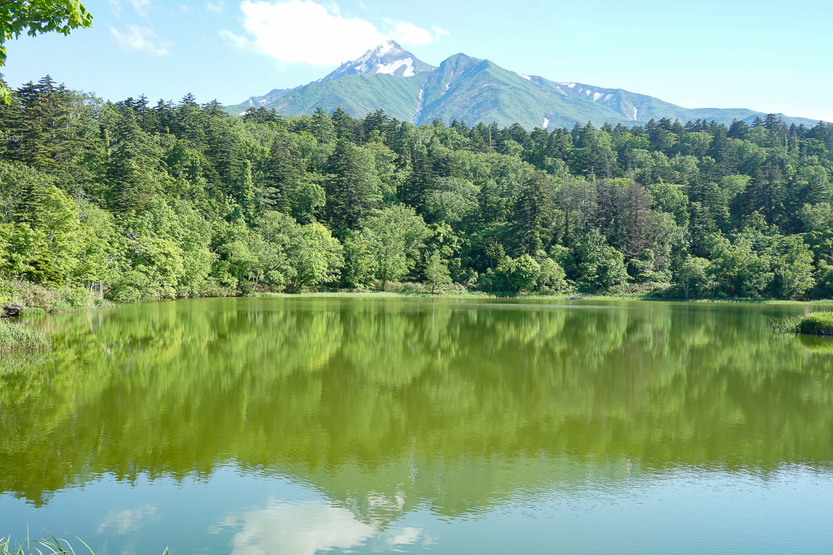 Mount Rishiri reflected in a calm lake